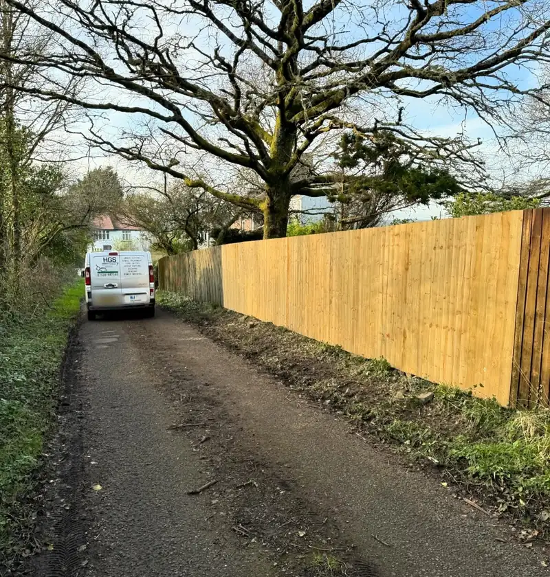 After: a straight new feather edge fence along the same lane in Crofty